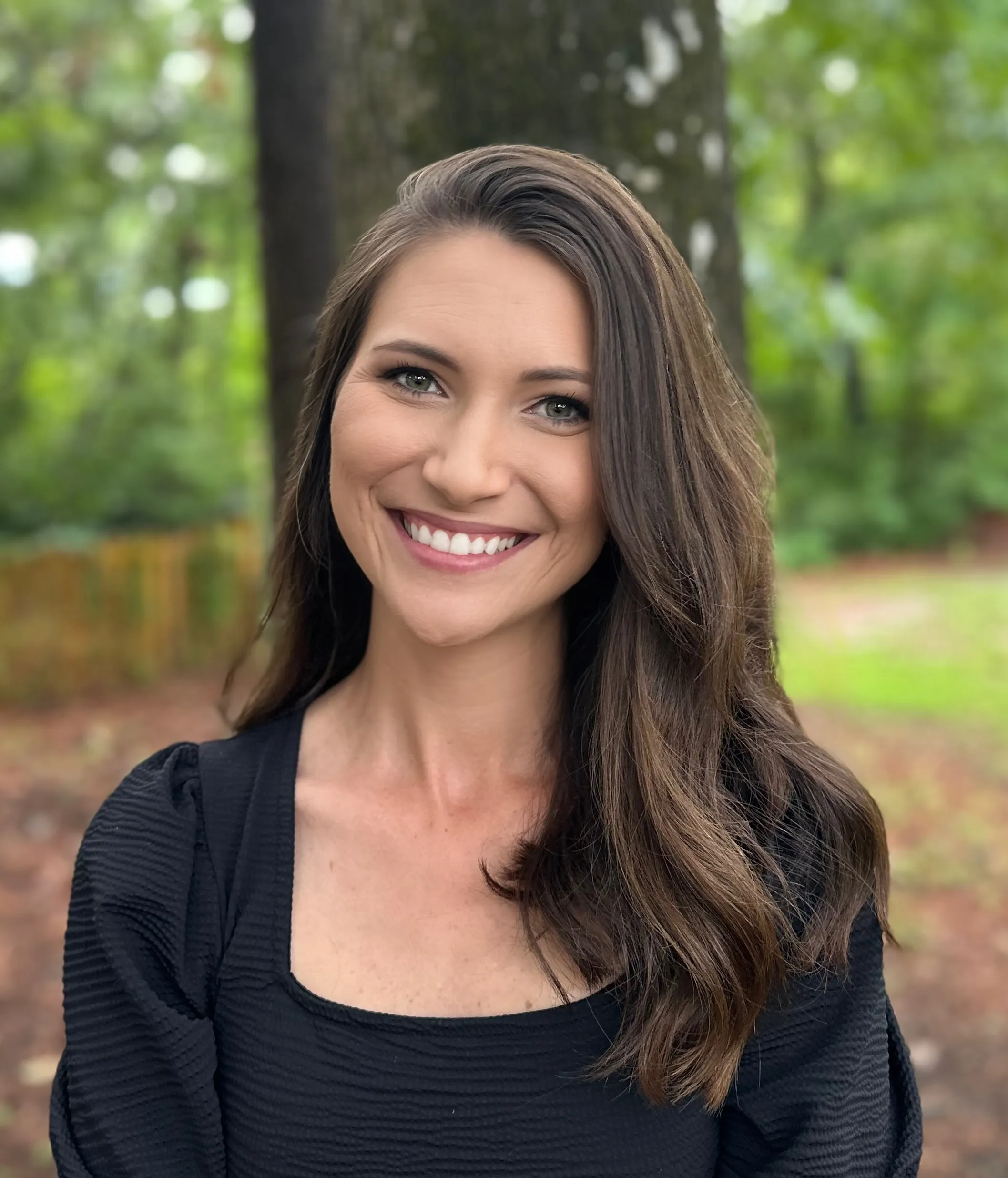 Alicia Lucas, M.A., LMFT, smiling outdoors